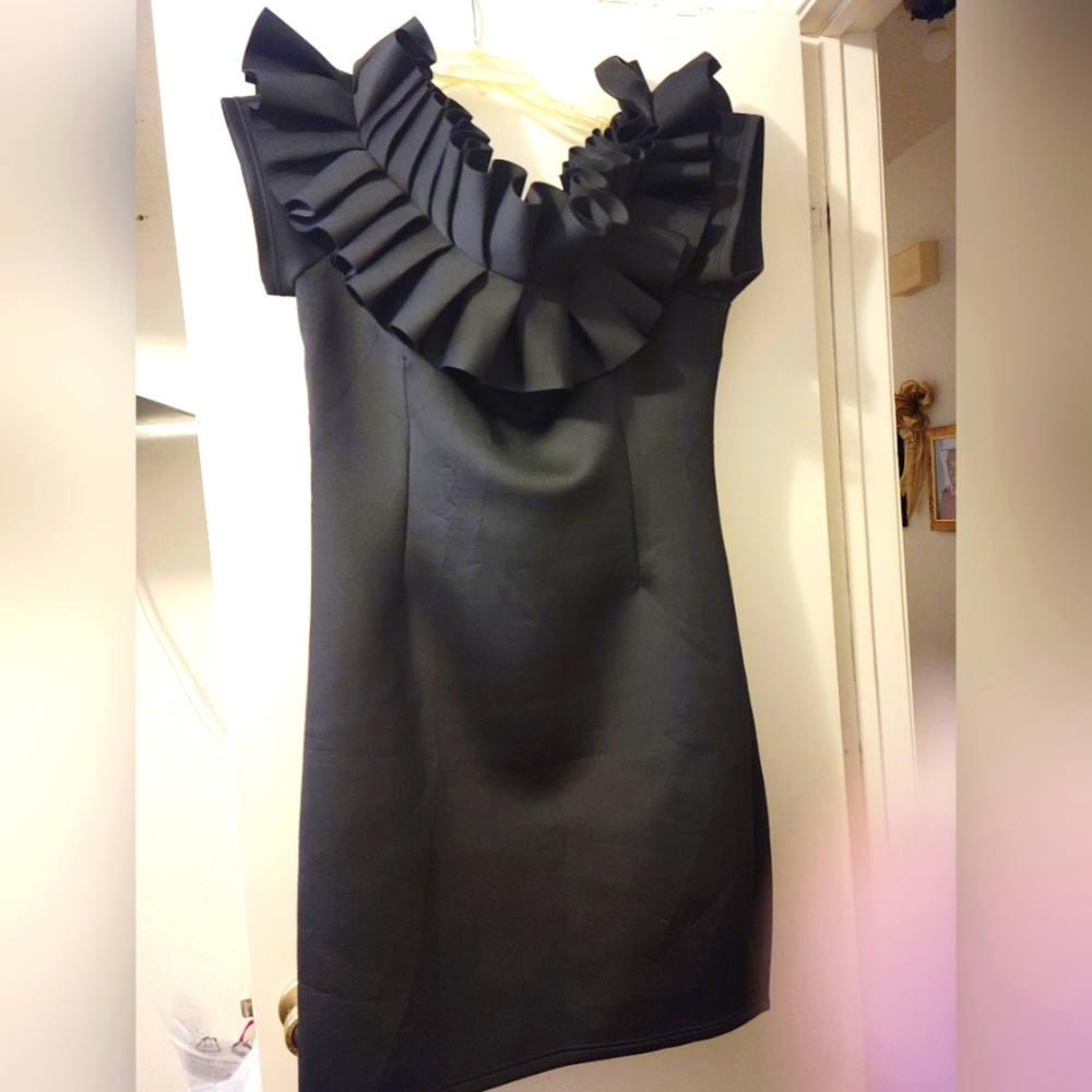 This cute LBD is a dressy ruffled dress suitable for date night, weddings ect.